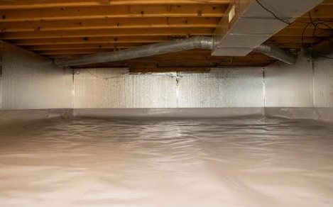 A crawl space with a sealed vapor barrier on the floor and insulated foundation walls